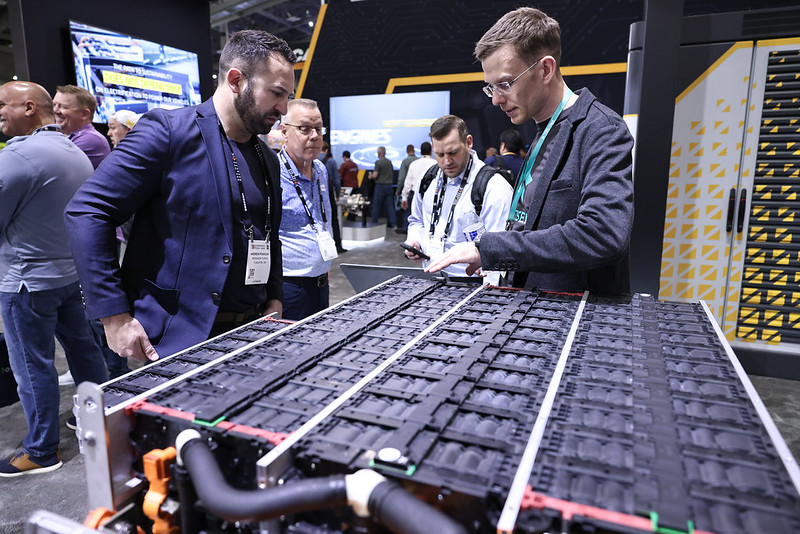 An exhibitor talks about electrification-related technology at CONEXPO-CON/AGG